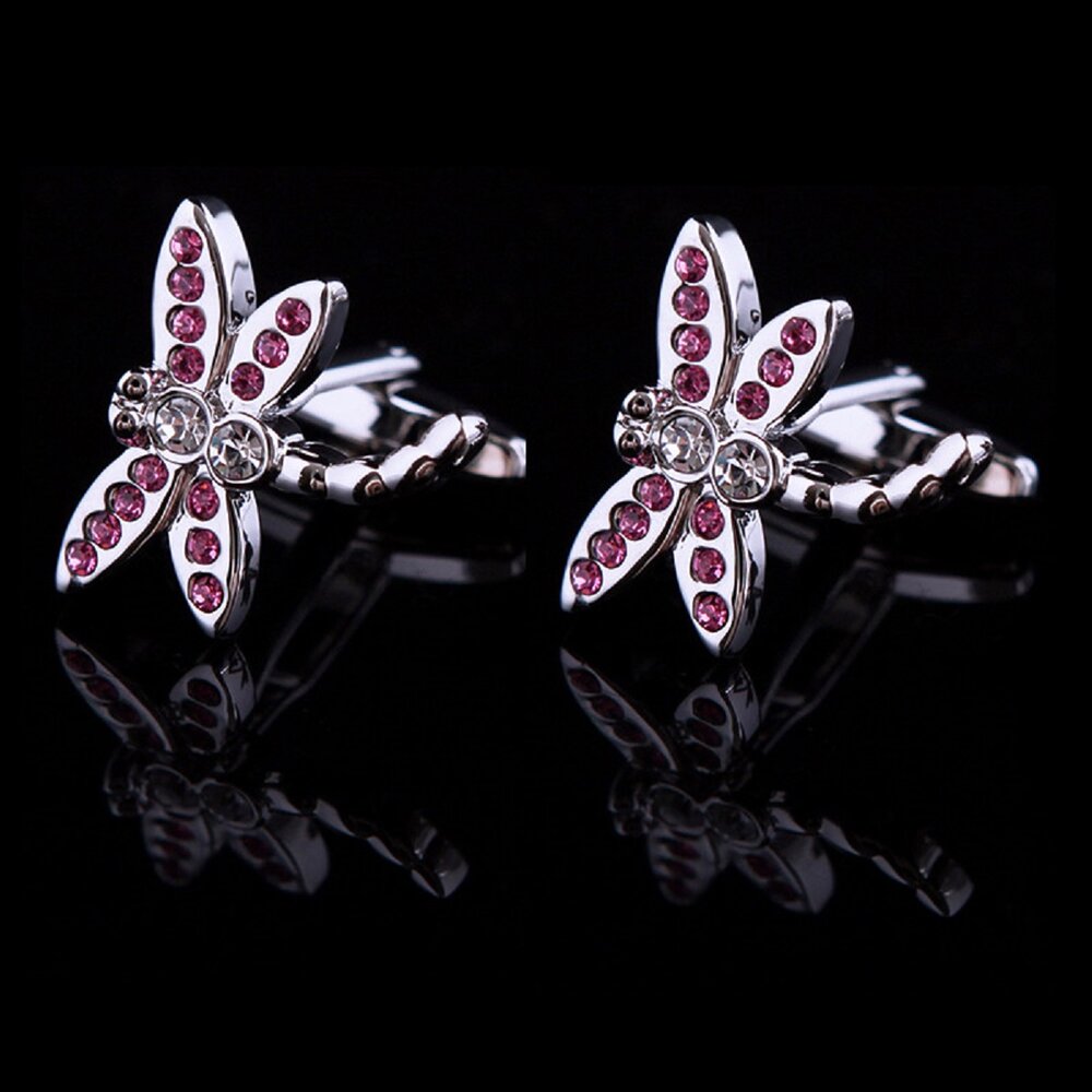 A chrome and pink color dragonfly shape pair of cuff-links.