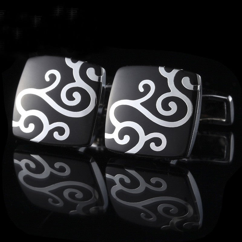 View 2: A Black, Chrome Colored Square Shaped With Vine Pattern Cuff-links.