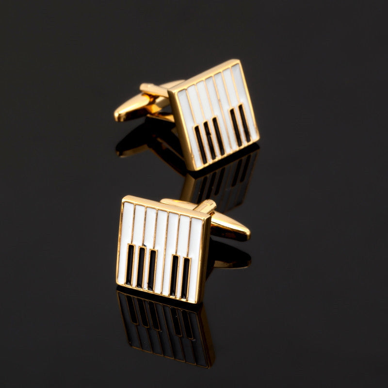 A Gold, Black, White Color Keyboard Shape Cuff-links Set