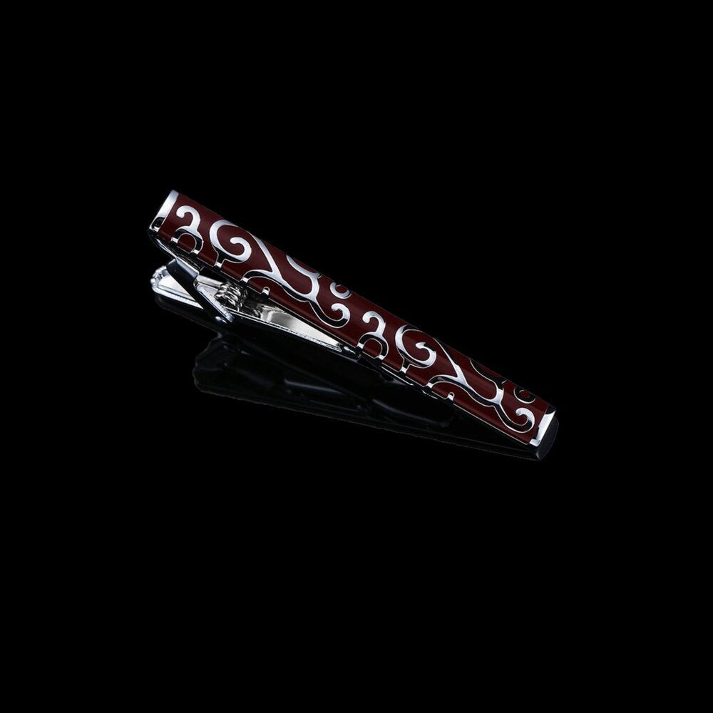 A Chrome with Mahogany Colored Vine Pattern Tie Bar