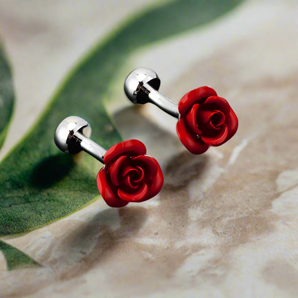 A small red colored rose shaped cuff-links||Red