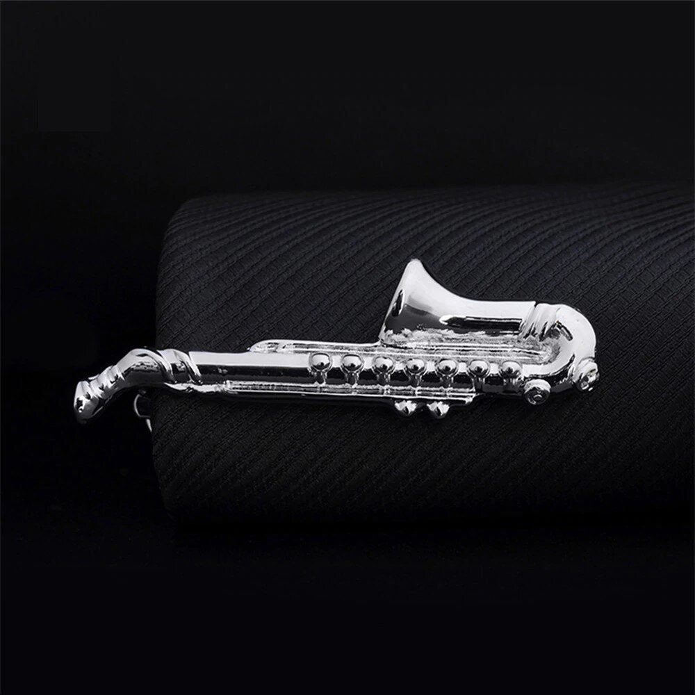 A Silvered Colored Saxophone Shape Tie Bar