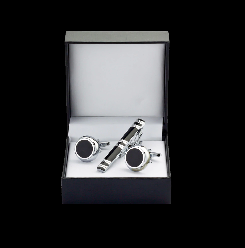 A chrome, black colored tie bar with rectangle shapes. The cuff-links are black chrome circular shaped pair.