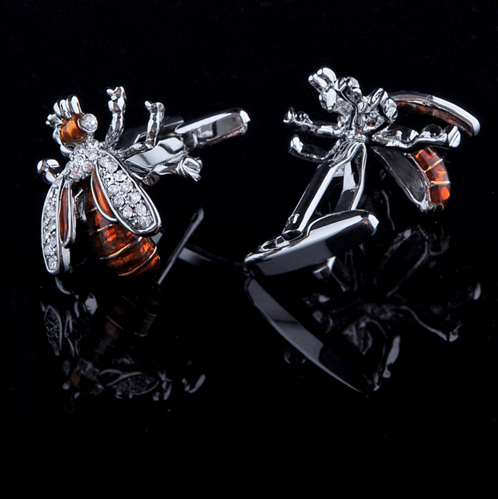 A Chrome, Orange Color Bee Pattern Pair of Cuff-links