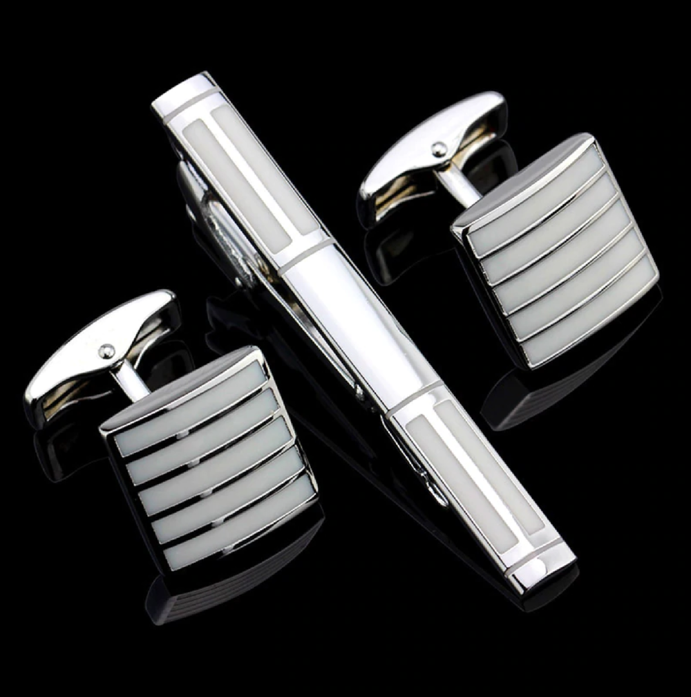 A Chrome, Pearl Lined Shaped Tie Bar and Cuff-links