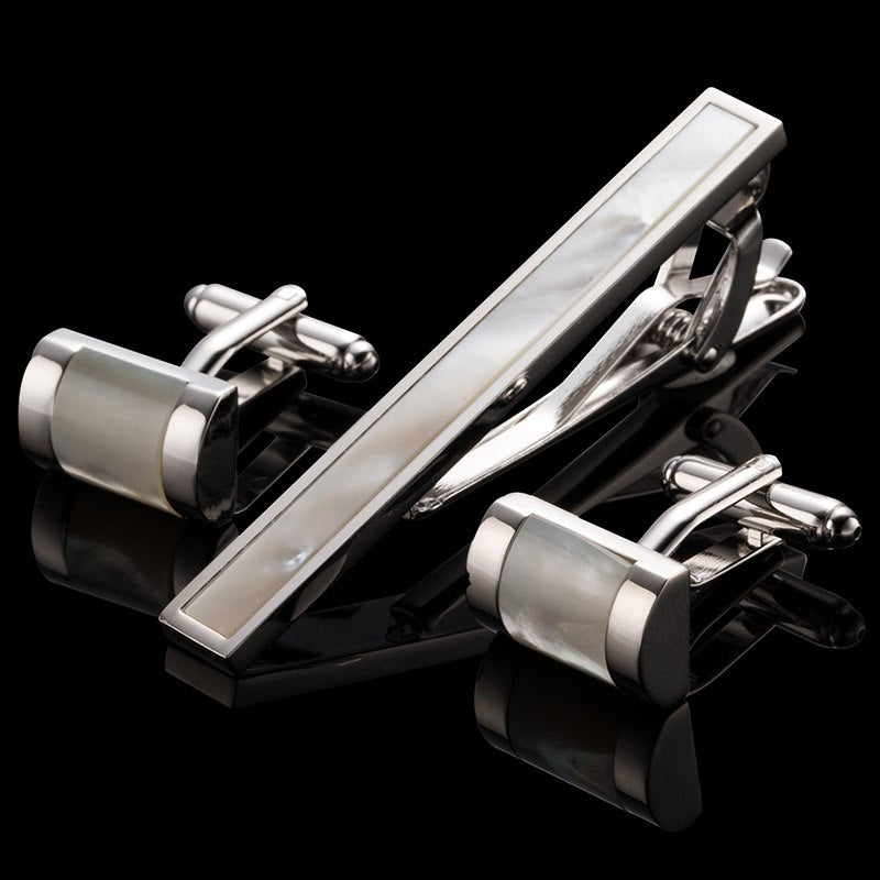A Chrome and Pearl Colored Sphere Shaped Tie Bar and Cuff-links Set