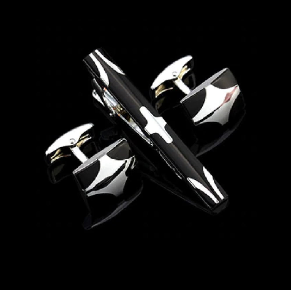 A Black, Chrome Colored X Shaped Tie Bar and Cuff-links