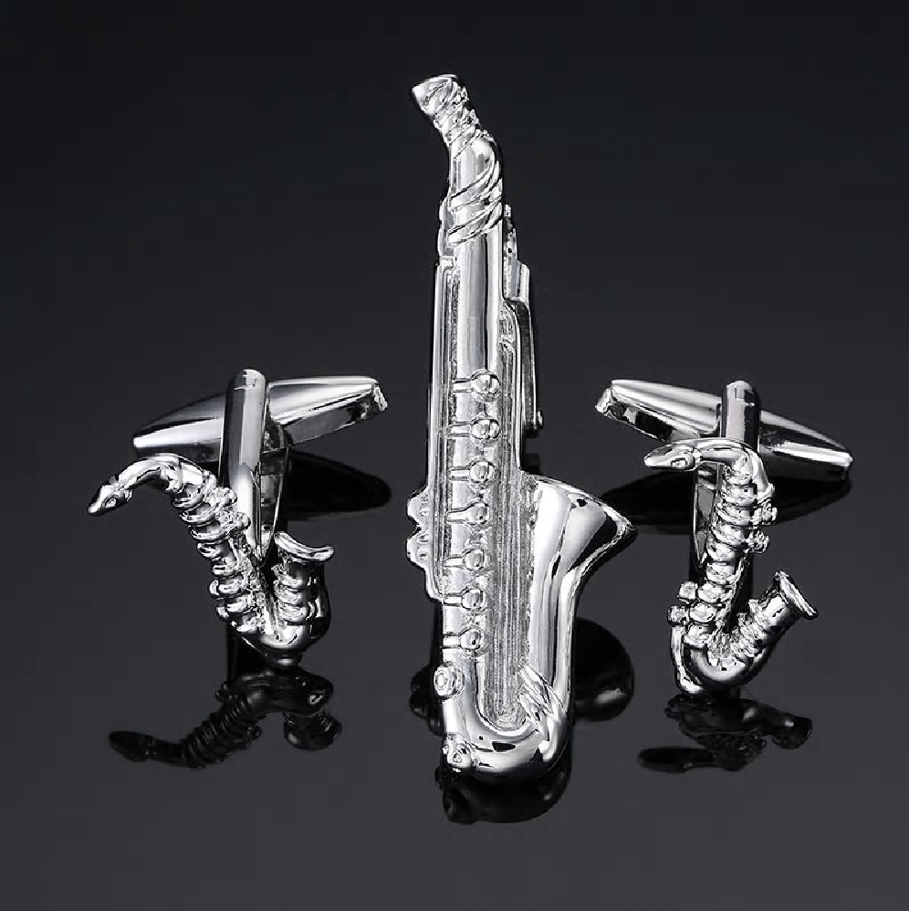 A Chrome Colored Saxophone Shaped Tie Bar and Cuff-links Set