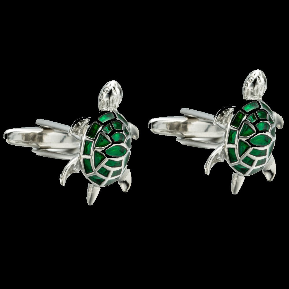 A chrome and green color turtle design pair of cuff-links.